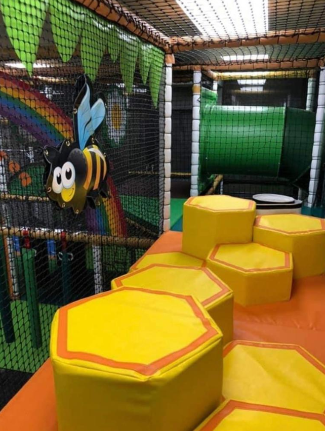 Neon Party Room with colorful soft play structures for kids' birthday parties and events.