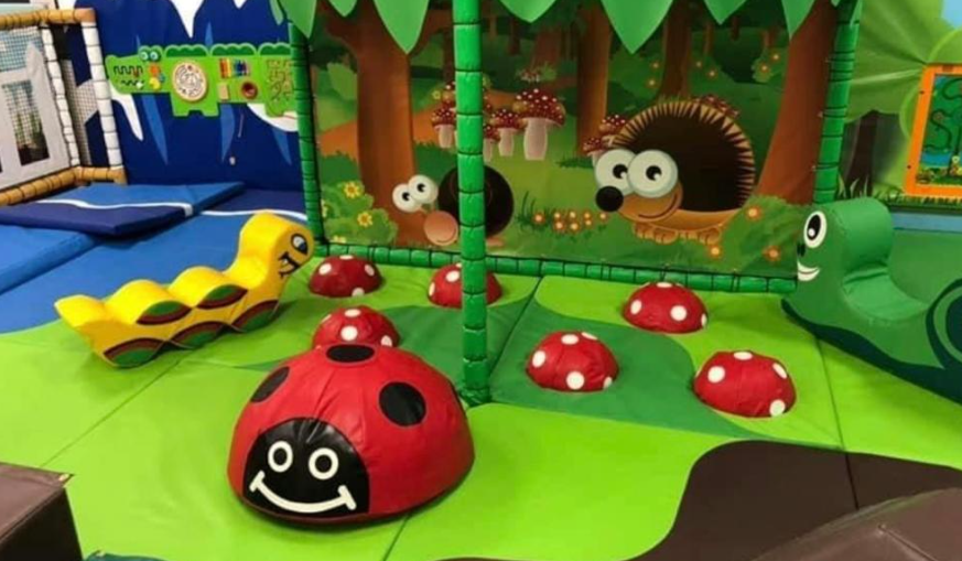 Neon Party Room with colorful soft play equipment for kids' events and family fun.