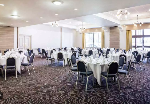 Training Room 1 at Mercure Dartford, elegant round tables for corporate events and gatherings.