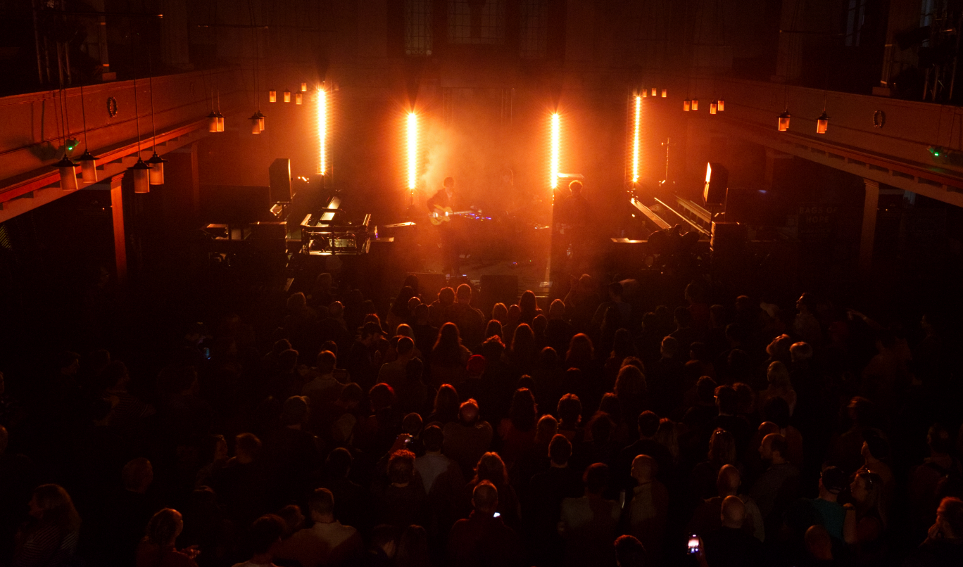 Vibrant live event at The Hall, Saint Philips Chapel Street with dramatic stage lighting.