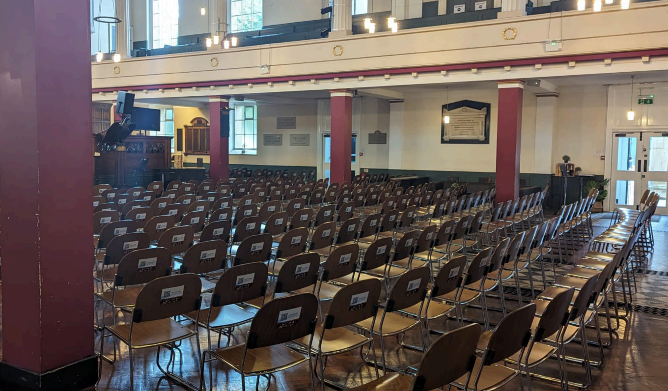 Event space in Saint Philips Chapel with arranged chairs for lectures and presentations.