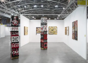 Contemporary art exhibition in Ab-Anbar Gallery with white walls and engaging layout.