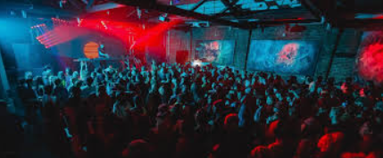 Vibrant event space at The Blue Bird Reno with DJ setup for lively concerts and gatherings.