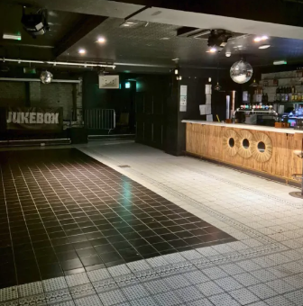 Private Hire event space in Wilson's Den with bar and jukebox for gatherings.