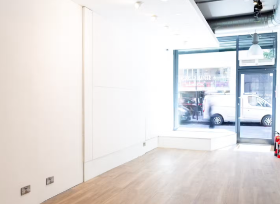 Versatile blank canvas event space with natural light at ST.ART Gallery for meetings and workshops.