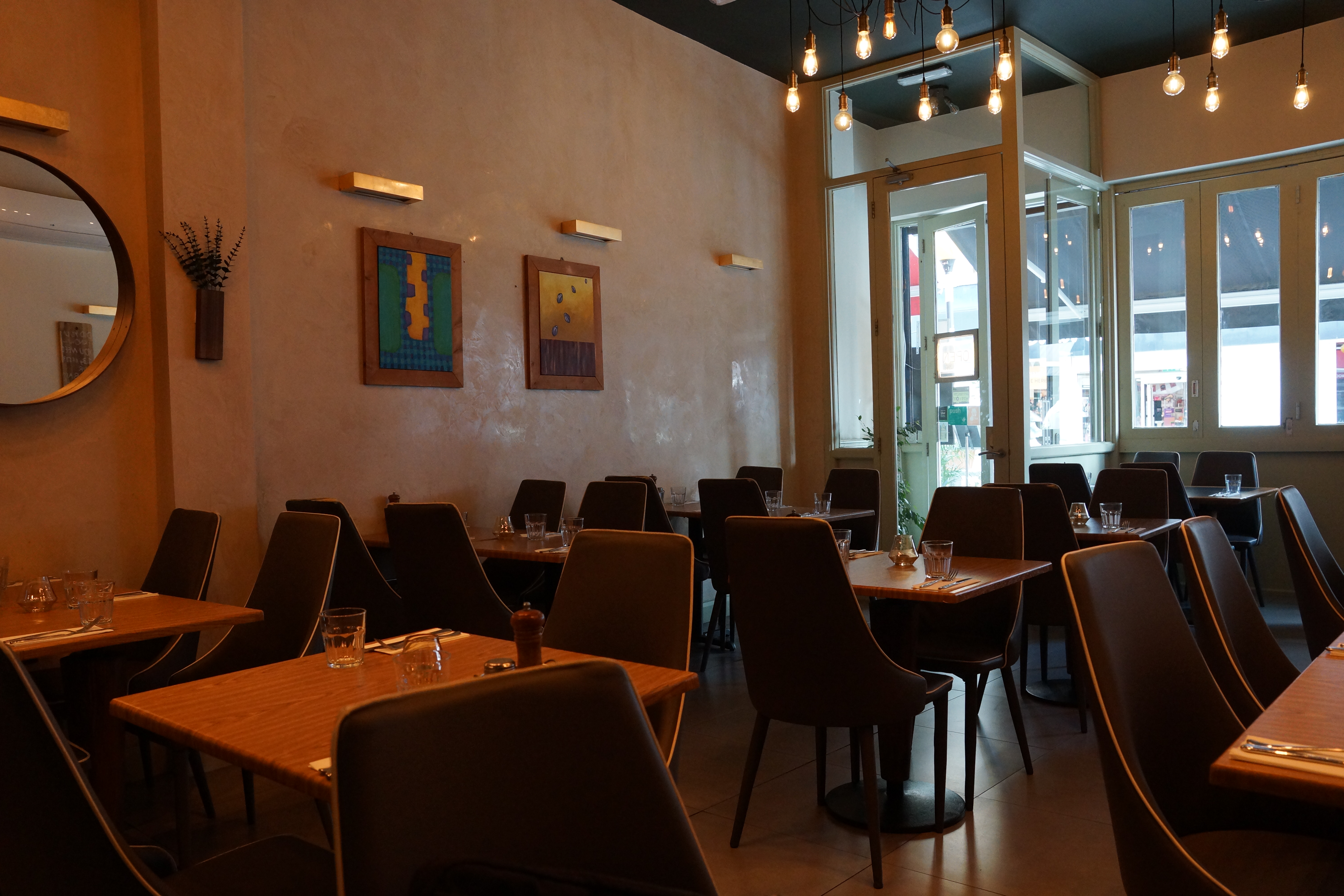Modern Koka Restaurant with warm lighting, ideal for intimate gatherings and corporate meetings.