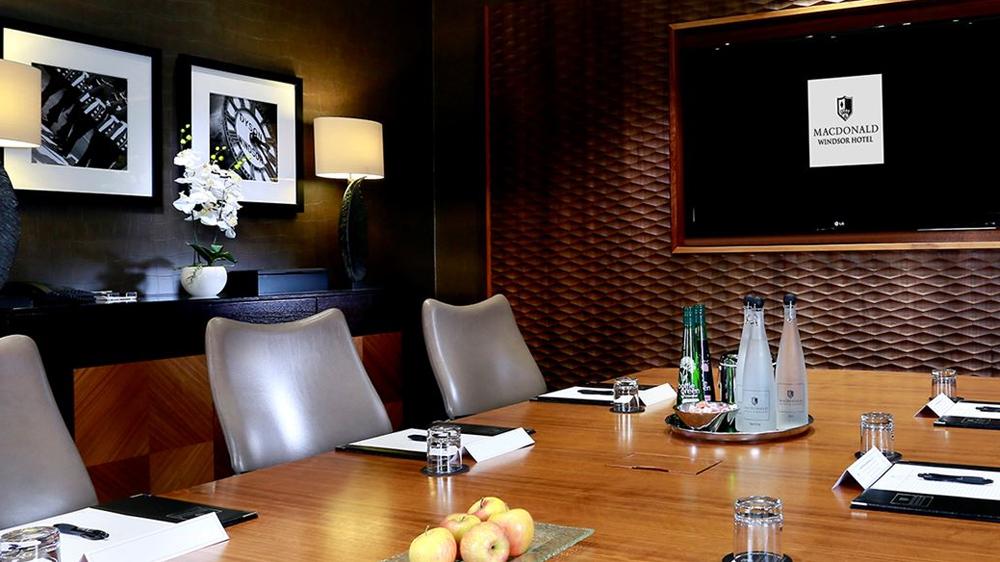 Kensington Boardroom at Macdonald Windsor Hotel, sleek table for professional meetings.