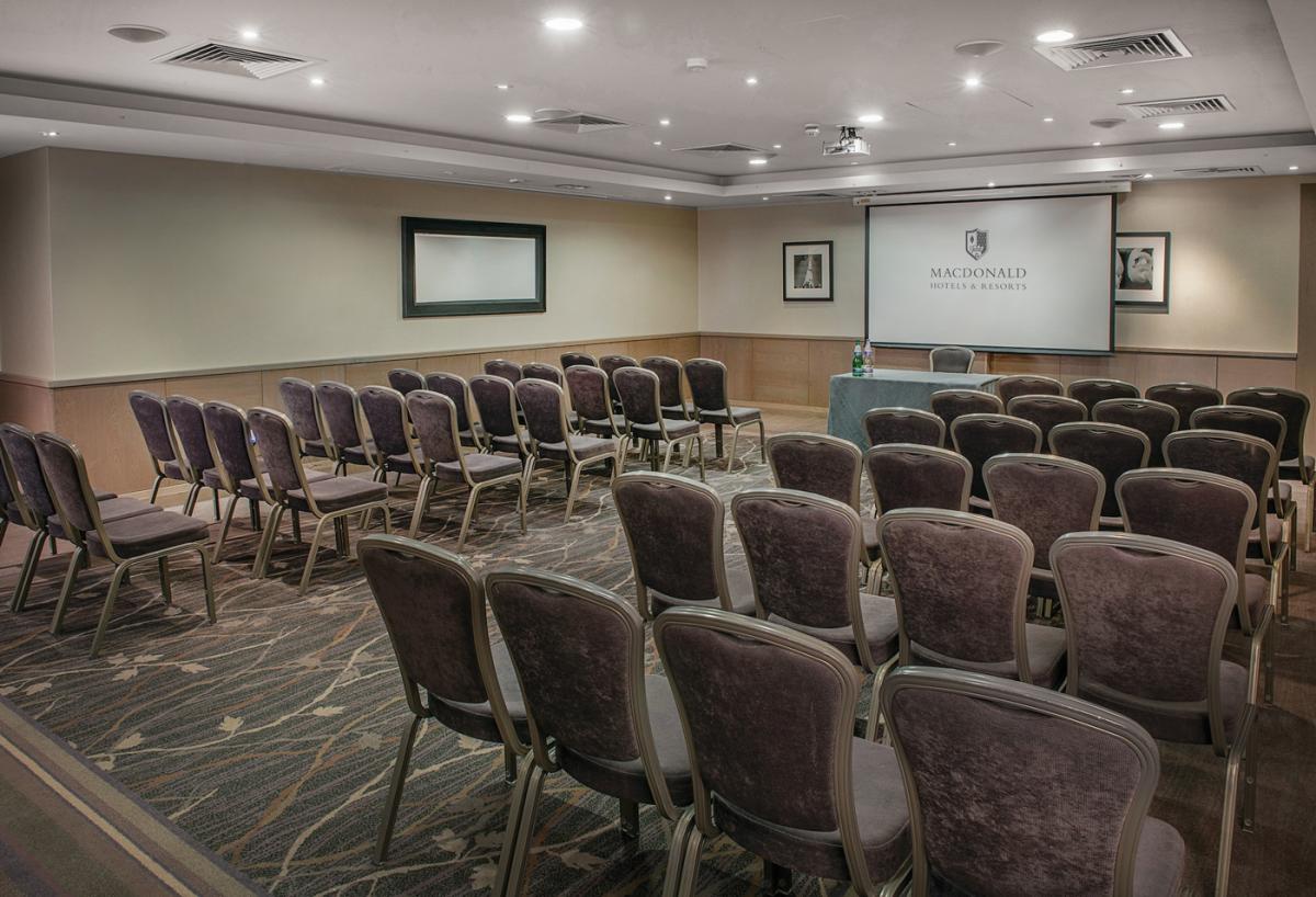Kensington Boardroom at Macdonald Windsor Hotel, ideal for corporate presentations.