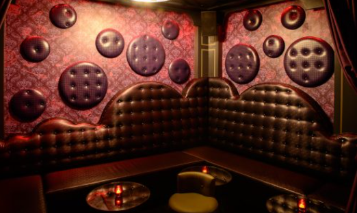 Stylish Leather Room lounge with textured walls, perfect for upscale events and gatherings.