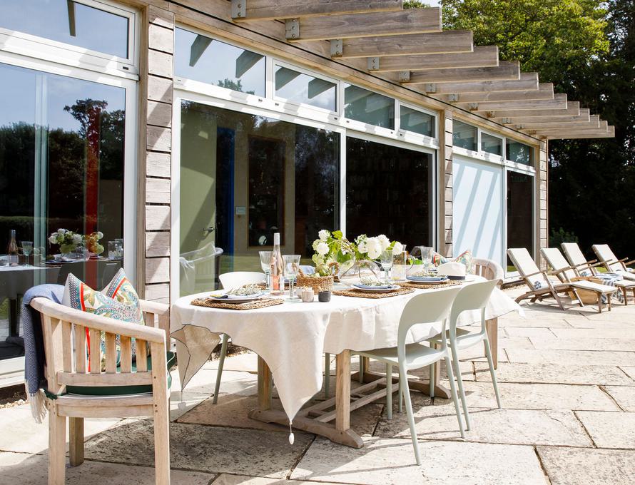 Outdoor dining space in Luxury Boltholes with elegant table setting for events.