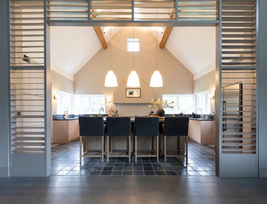 Spacious modern meeting space with high ceilings in Luxury Boltholes for events.