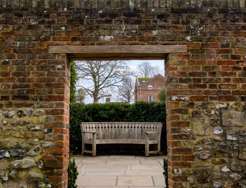 Courtyard Garden with rustic archway, ideal for events and networking.