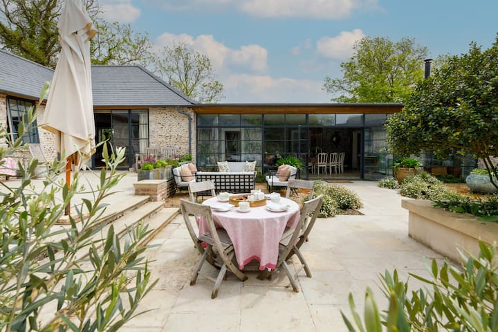 Courtyard Garden at Luxury Boltholes, elegant table setup for intimate events and gatherings.