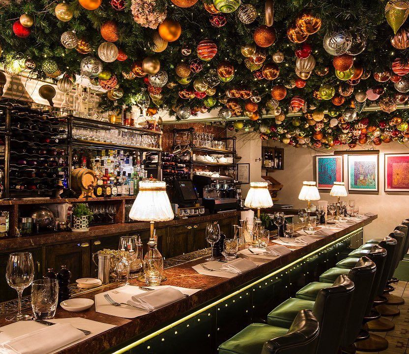 Elegant bar at Daphne's with festive decor, perfect for upscale events and gatherings.