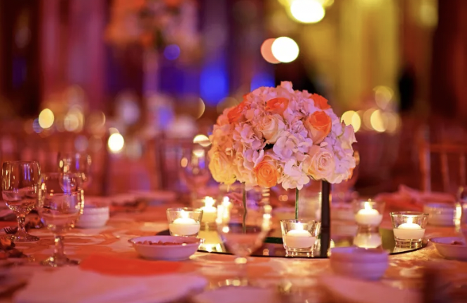 Elegant table setting with floral centerpiece for weddings and upscale events.