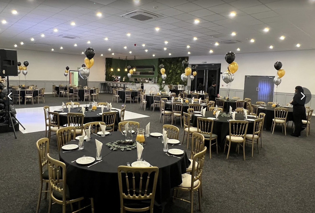 Elegant event space with round tables, perfect for formal gatherings and celebrations.