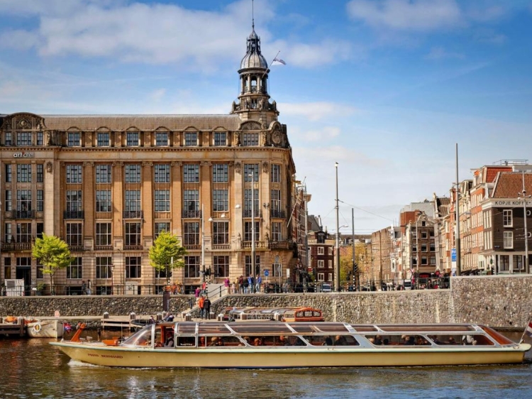 Event spaces at art'otel Amsterdam with historic architecture and waterfront views.