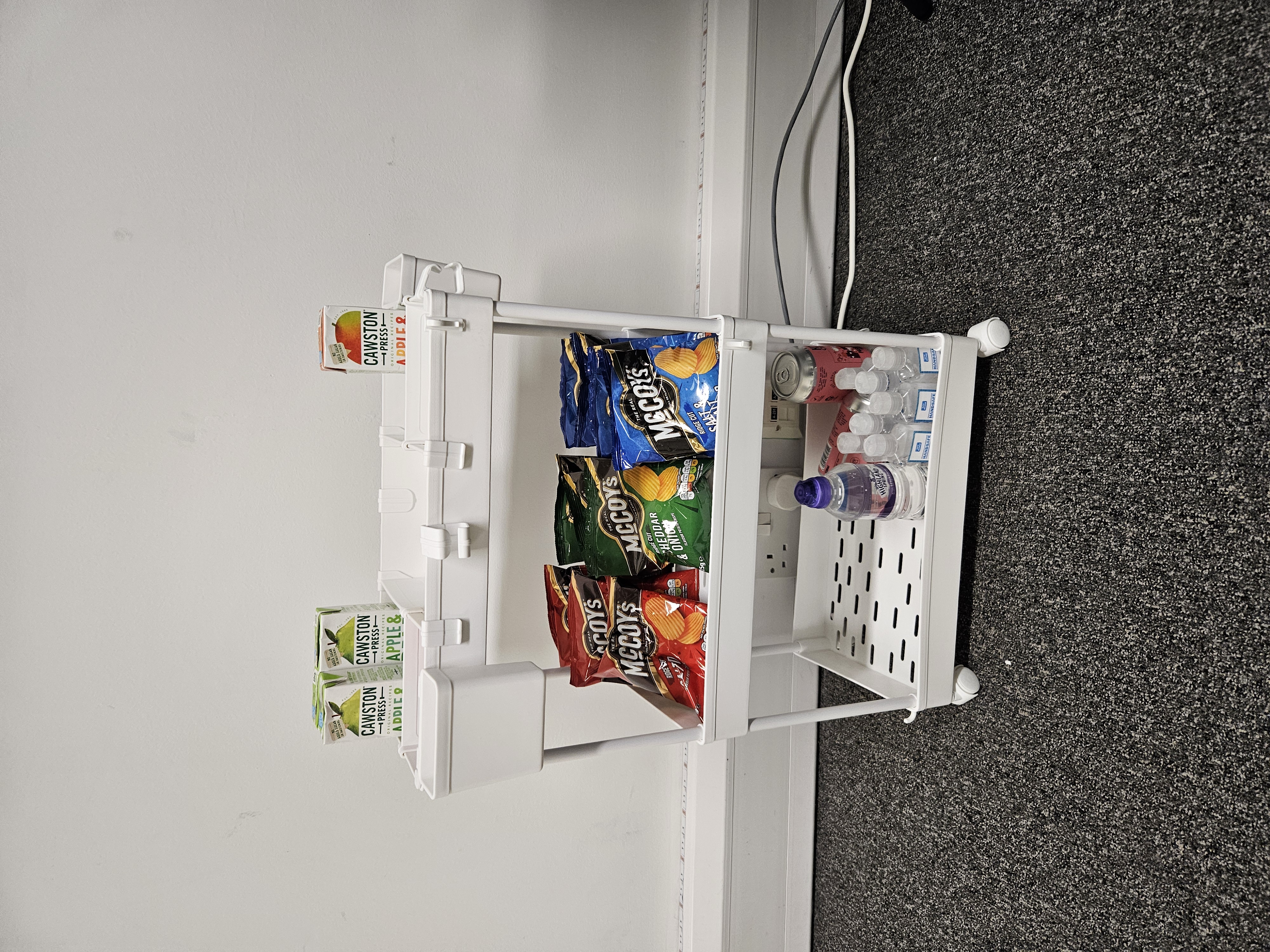Individual counselling snack station with McCoy's crisps and juice boxes at Basepoint Dartford.