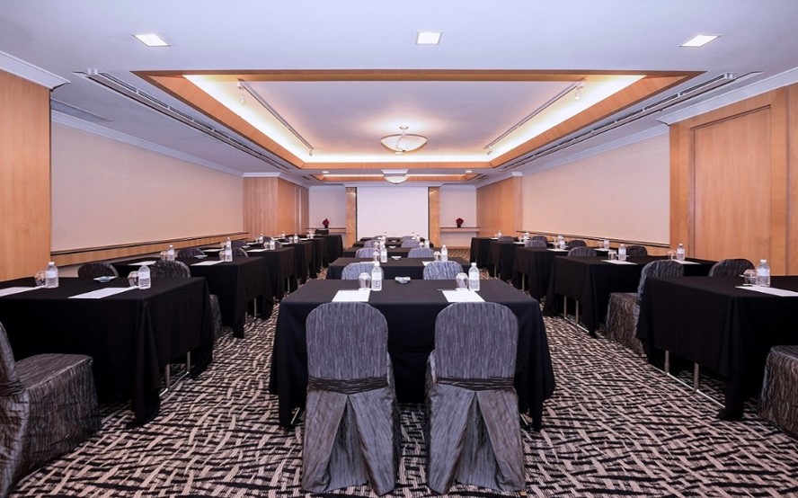 Meeting room in M Hotel Singapore with black linens, ideal for corporate events.