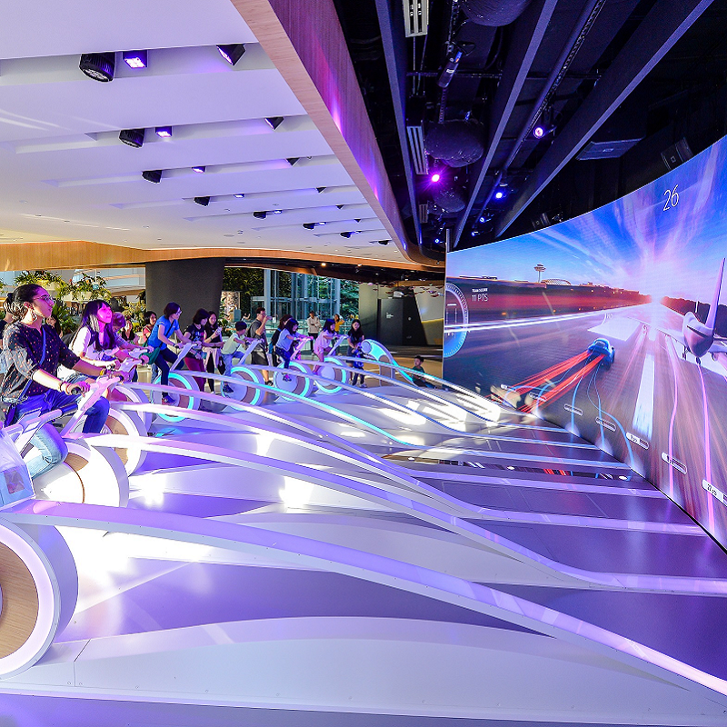 Changi Experience Studio seminar room, vibrant lighting, tech event venue.