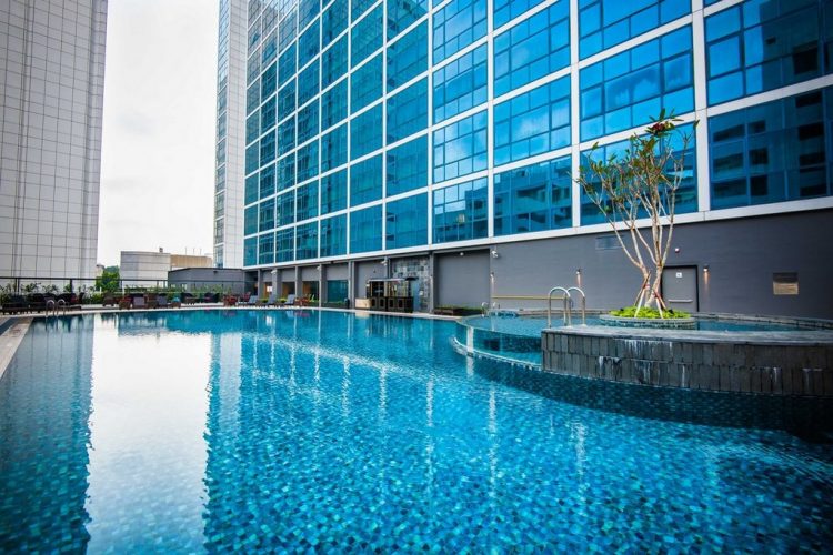 Modern hotel pool at Orchard Hotel Singapore, ideal for outdoor events and networking.