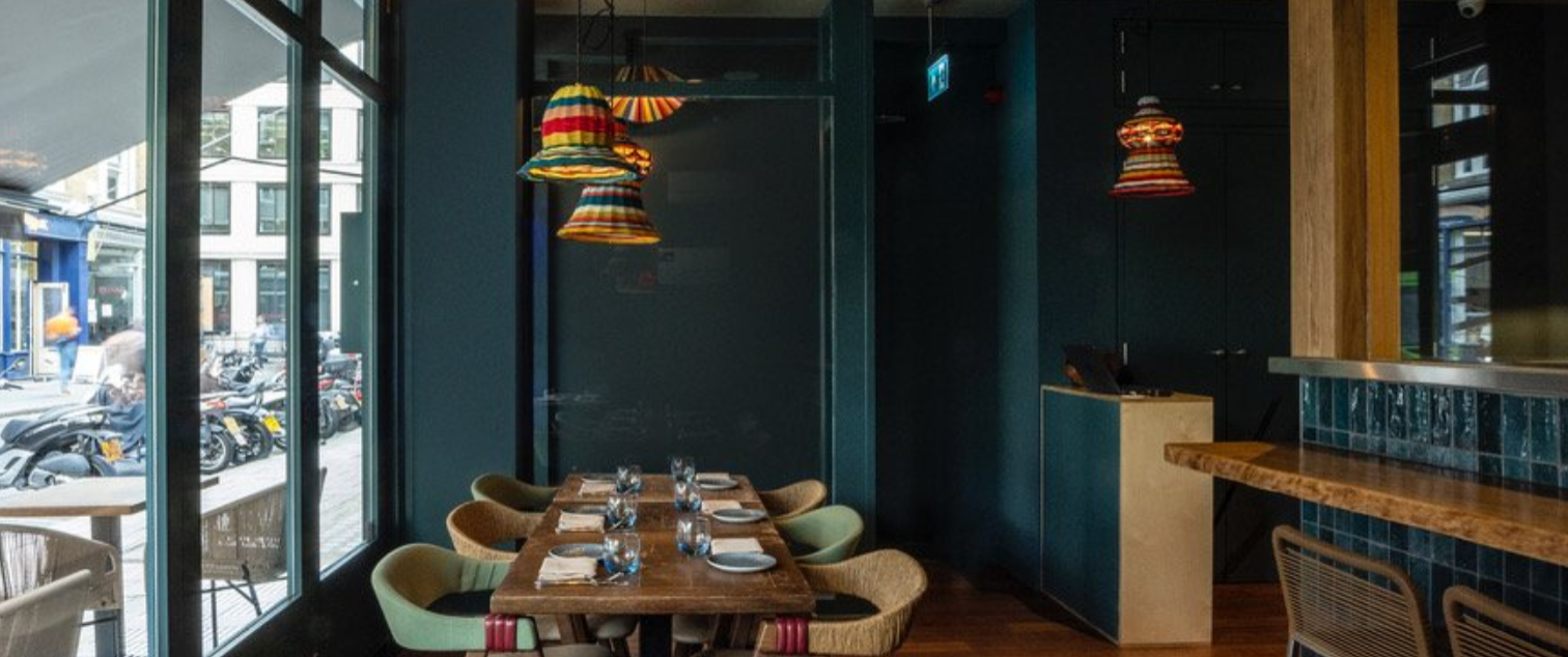 Stylish dining space in Lima Fitzrovia with vibrant lights, ideal for small events.