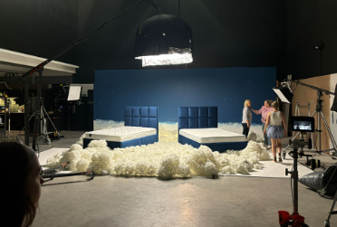 Customizable event setup with whimsical beds and cloud installation at Dead Pixel Studios.