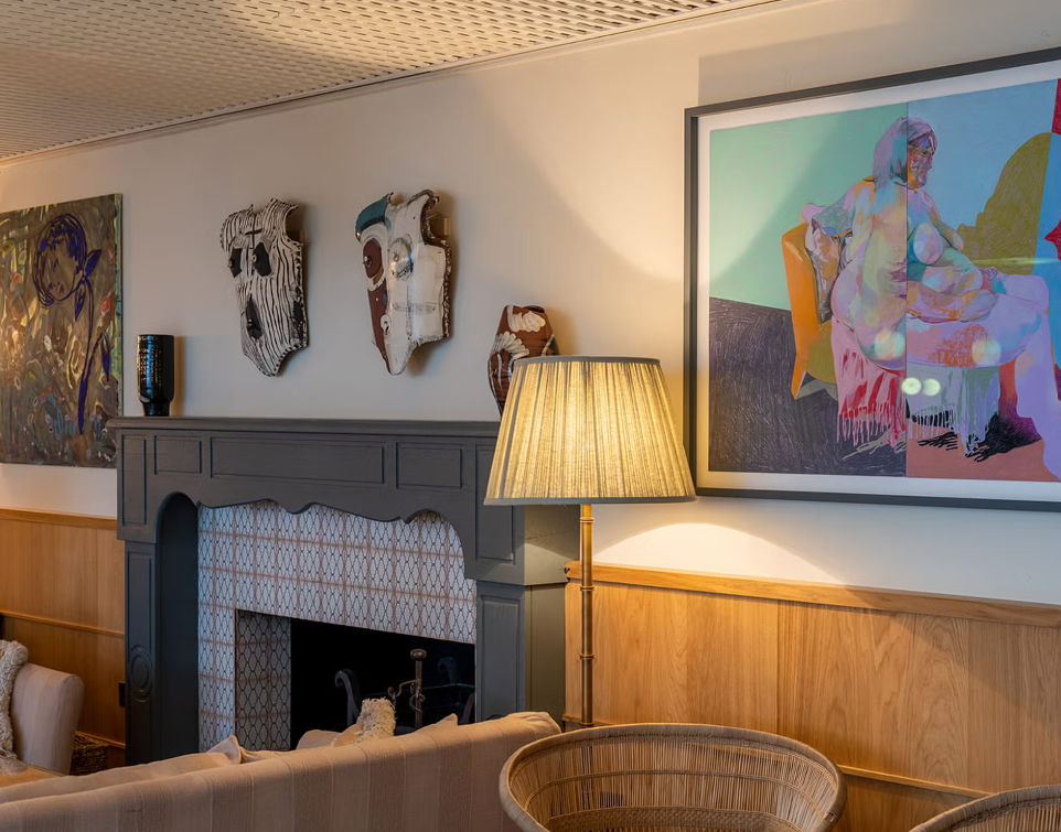 Stylish meeting space with cozy furnishings and art, perfect for networking events.