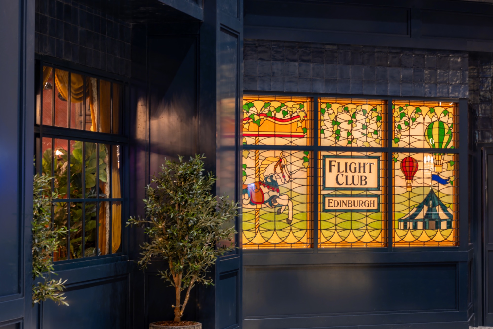 Stained glass window at Flight Club Edinburgh, perfect for creative networking events.