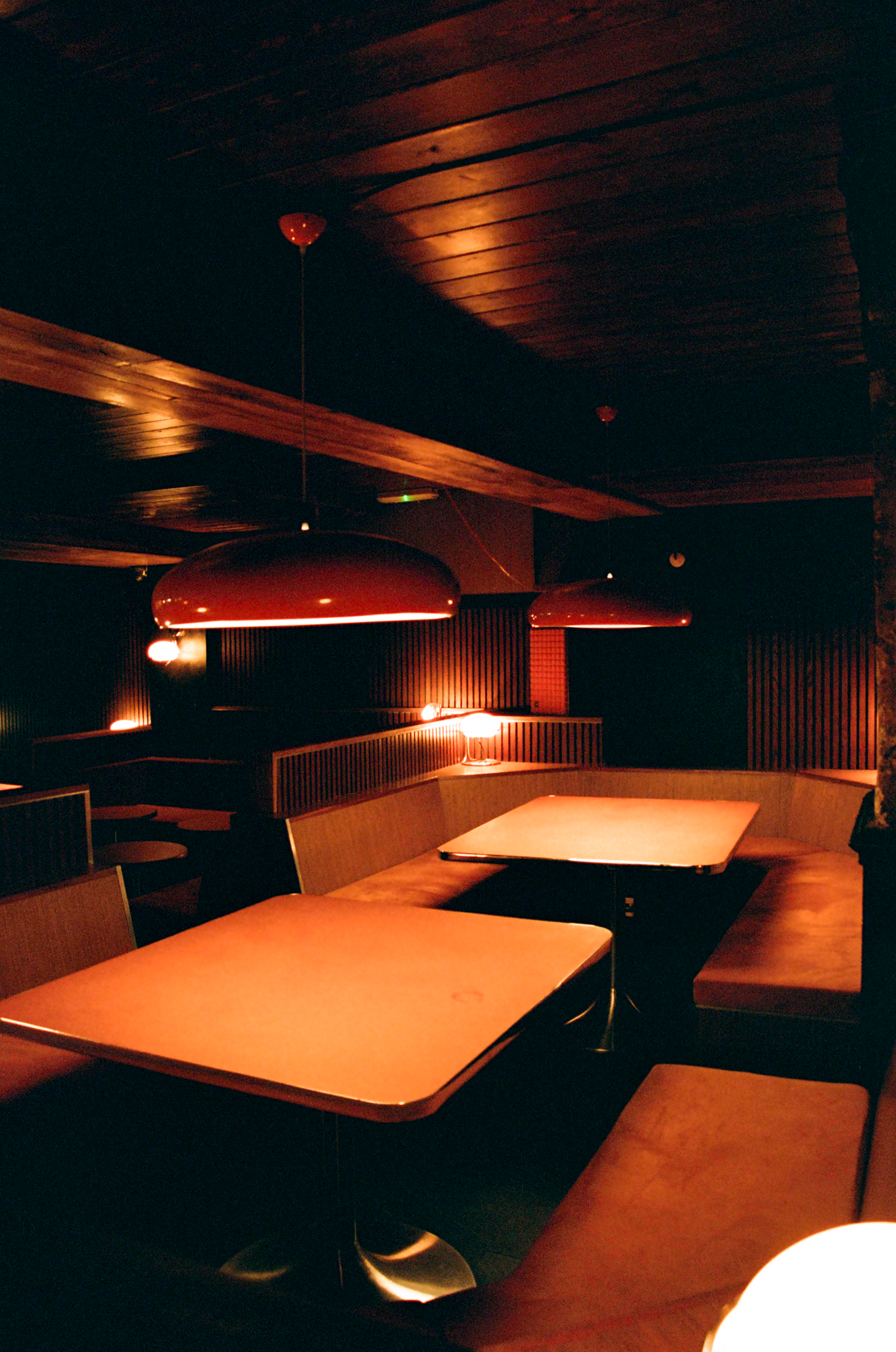 Stylish Marquee Moon Basement with red lights, perfect for networking events and gatherings.