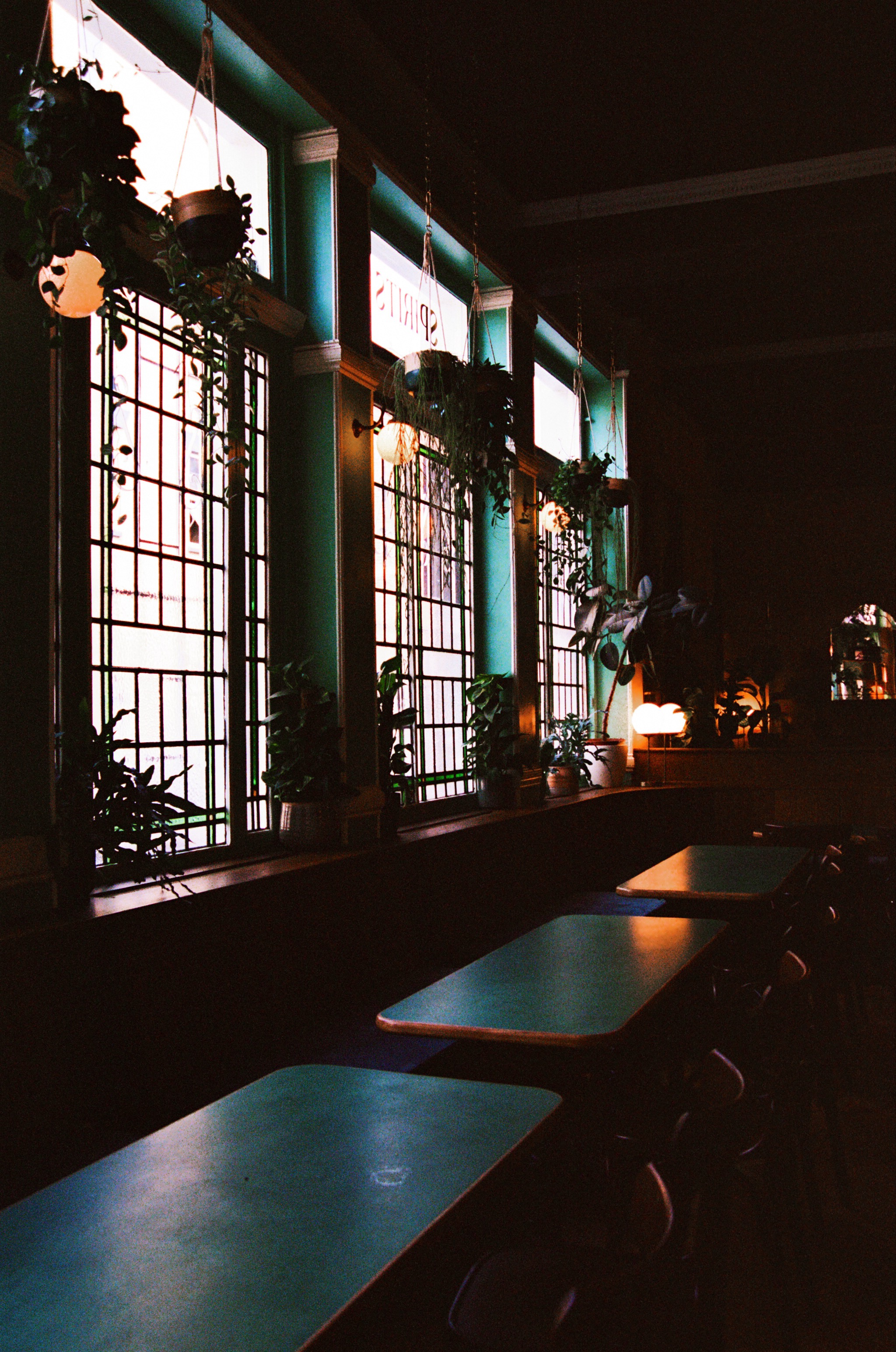 Cozy Marquee Moon Basement with stained glass, ideal for intimate gatherings and networking.