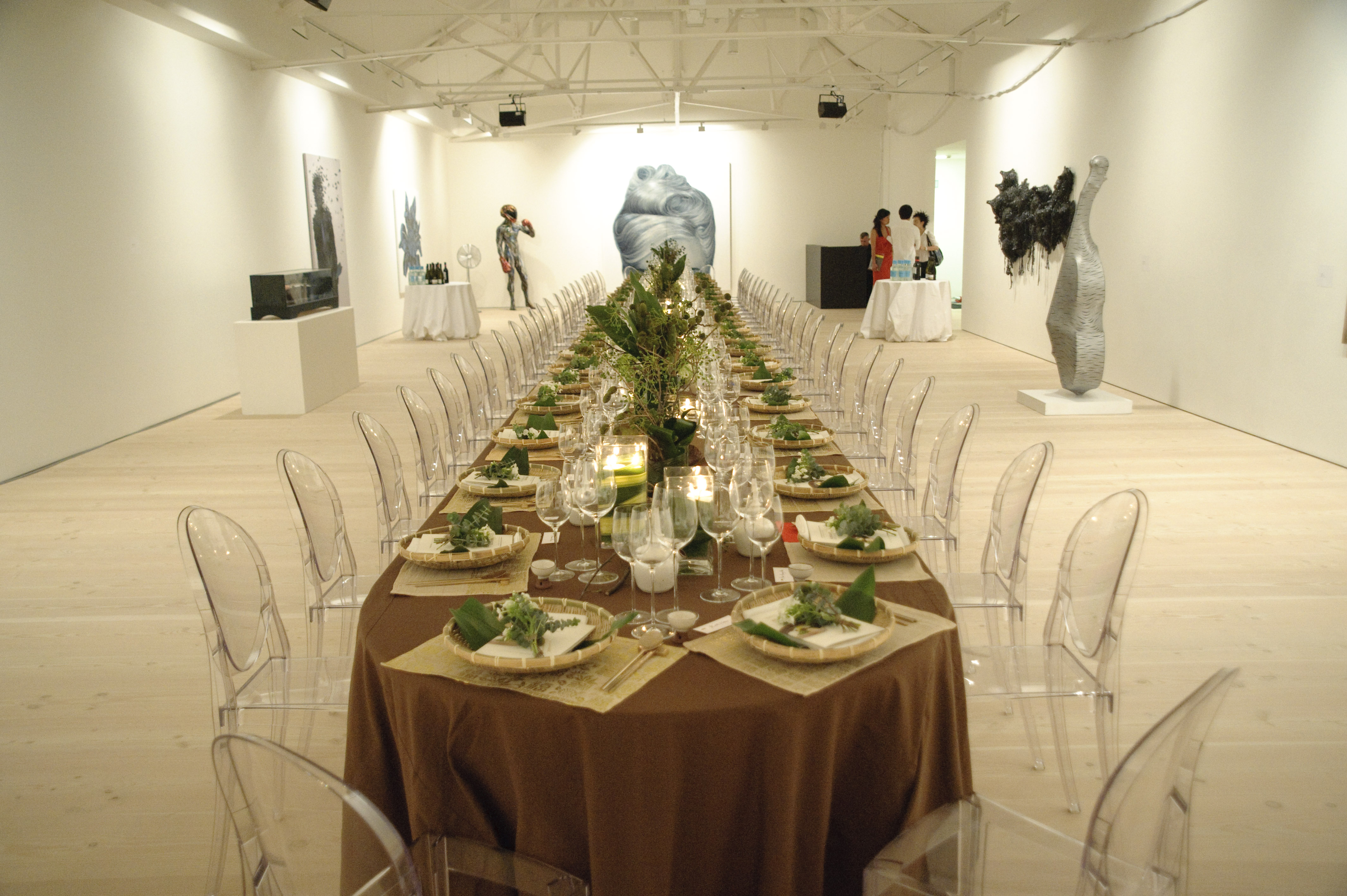 Elegant dining setup with acrylic chairs at Saatchi Gallery for corporate events.