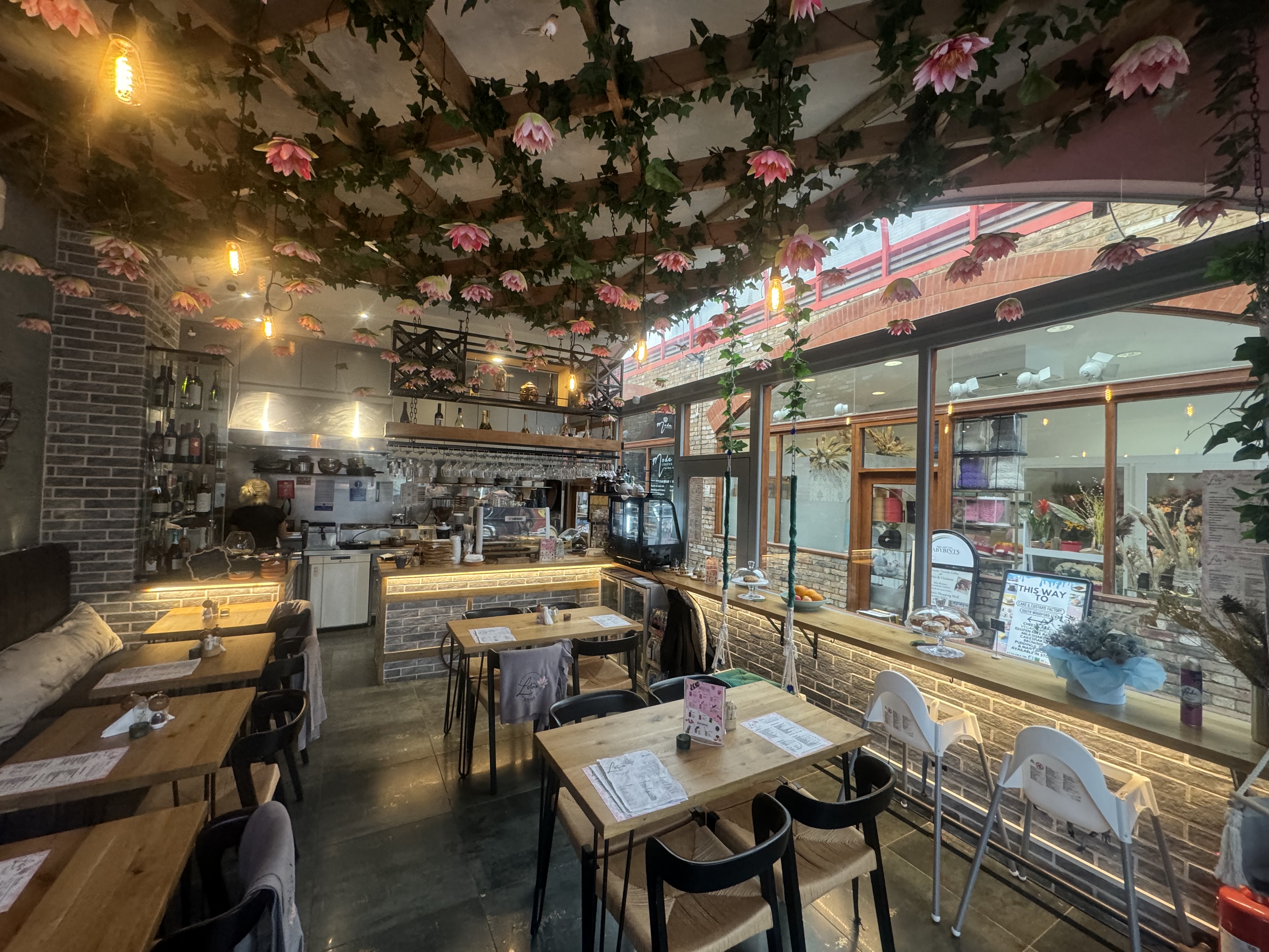 Charming Lotus Bistro with warm lighting, ideal for intimate gatherings and events.