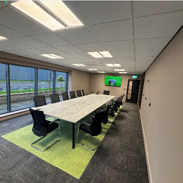 Modern conference room with ergonomic chairs for professional meetings and events.