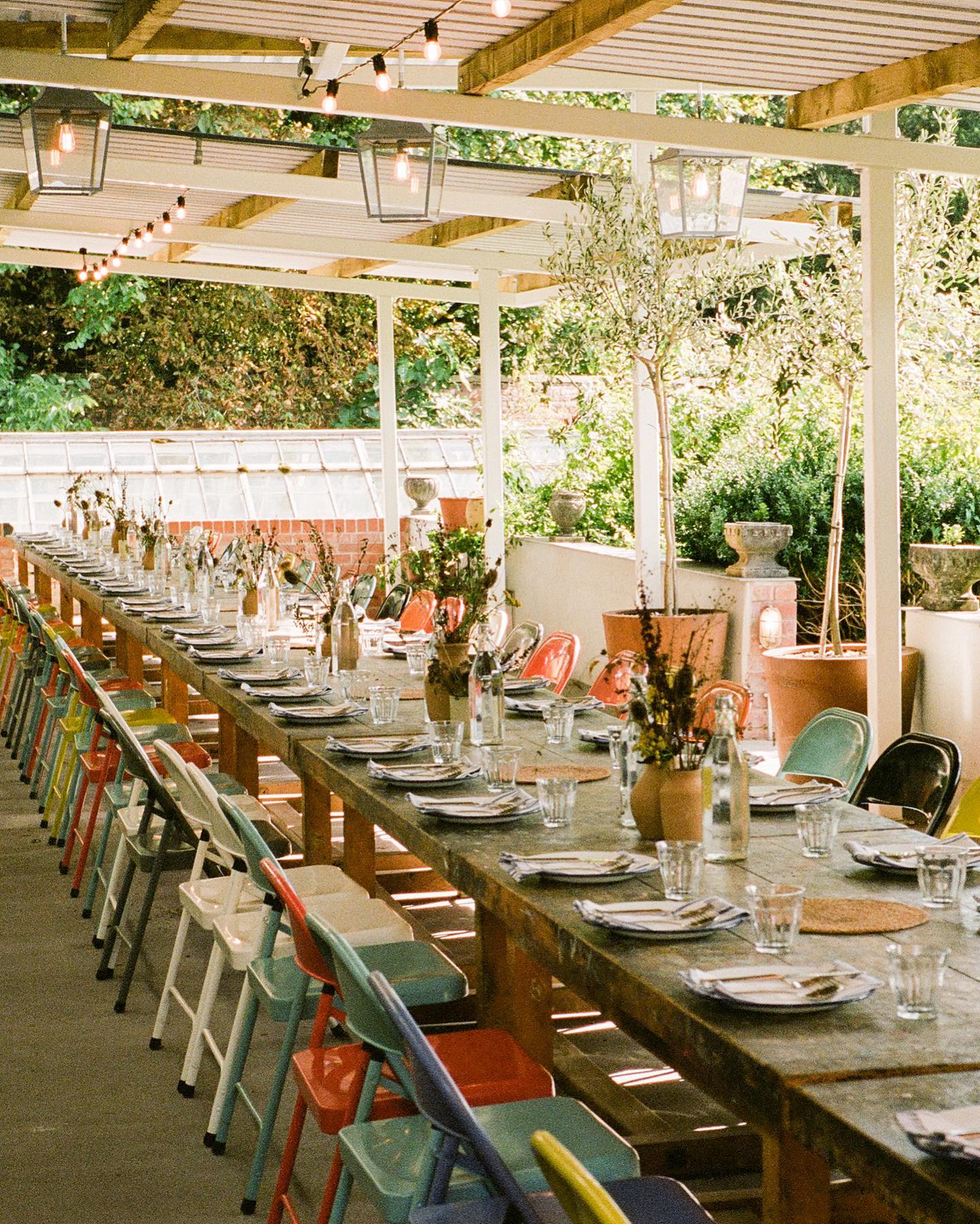 Outdoor dining setup in The Walled Garden, perfect for rustic events and gatherings.