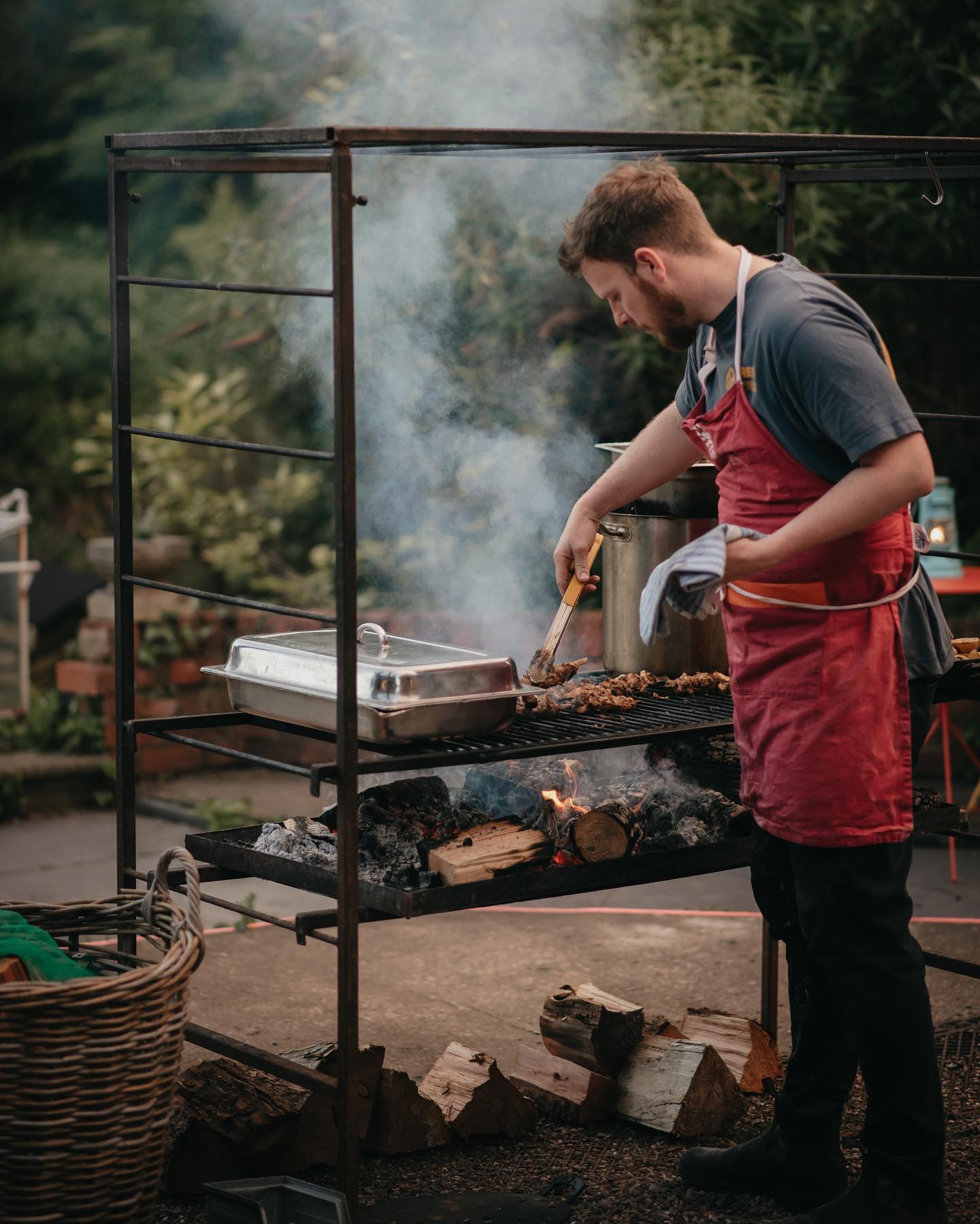 Chef cooking outdoors in The Walled Garden, perfect for unique culinary events and retreats.