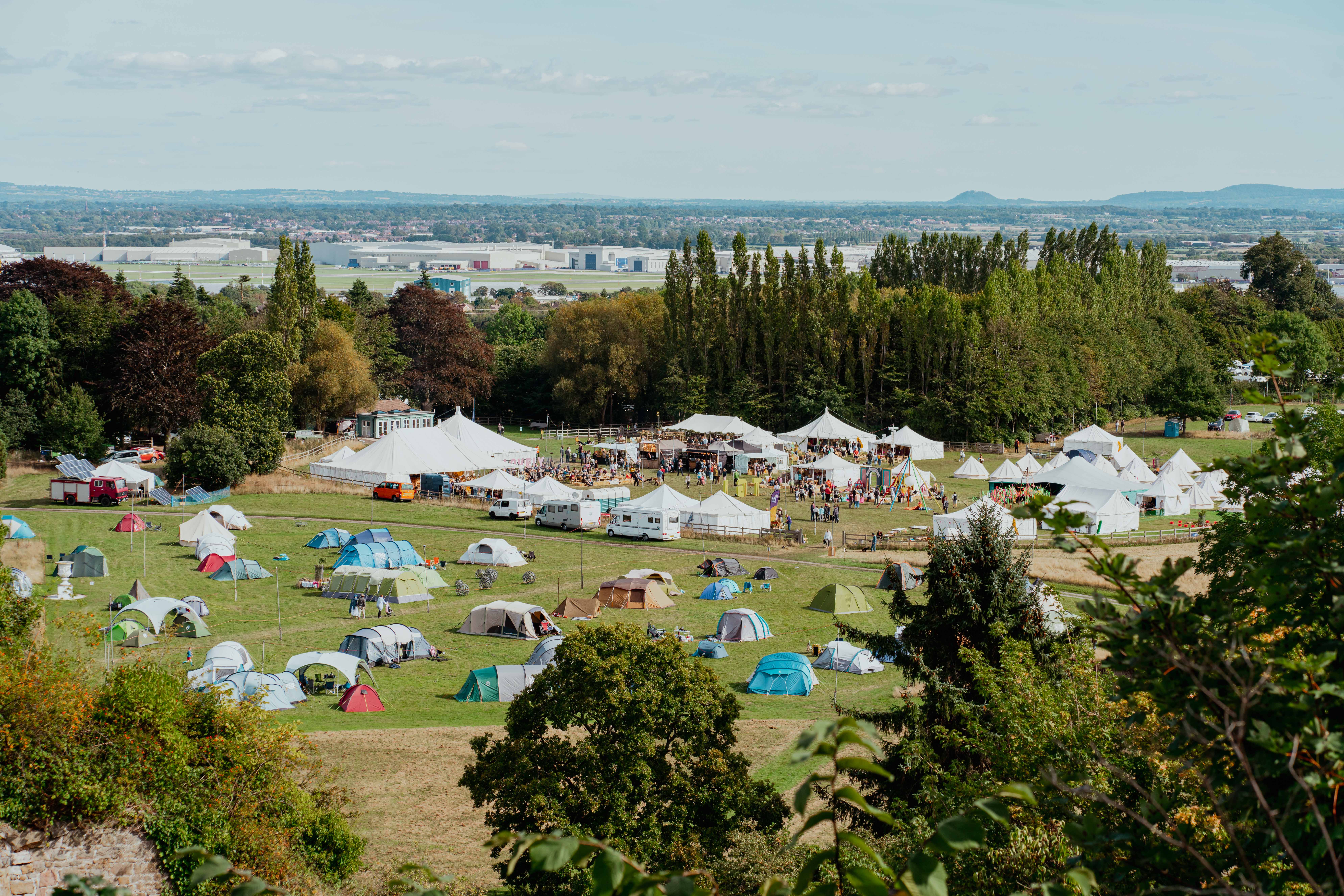 Hawarden Castle Pavilion with tents for outdoor festival and team-building events.