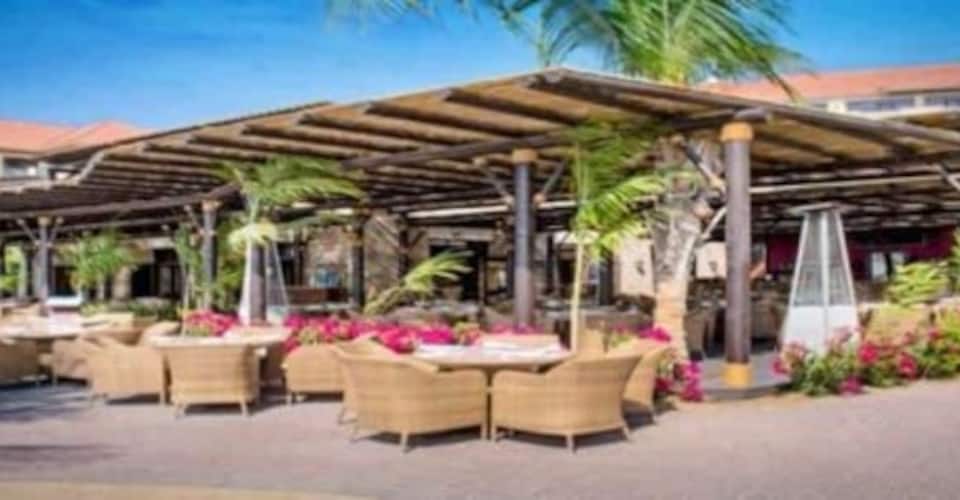 Maui Beach Restaurant outdoor event space with wicker seating in Dubai. Perfect for gatherings.