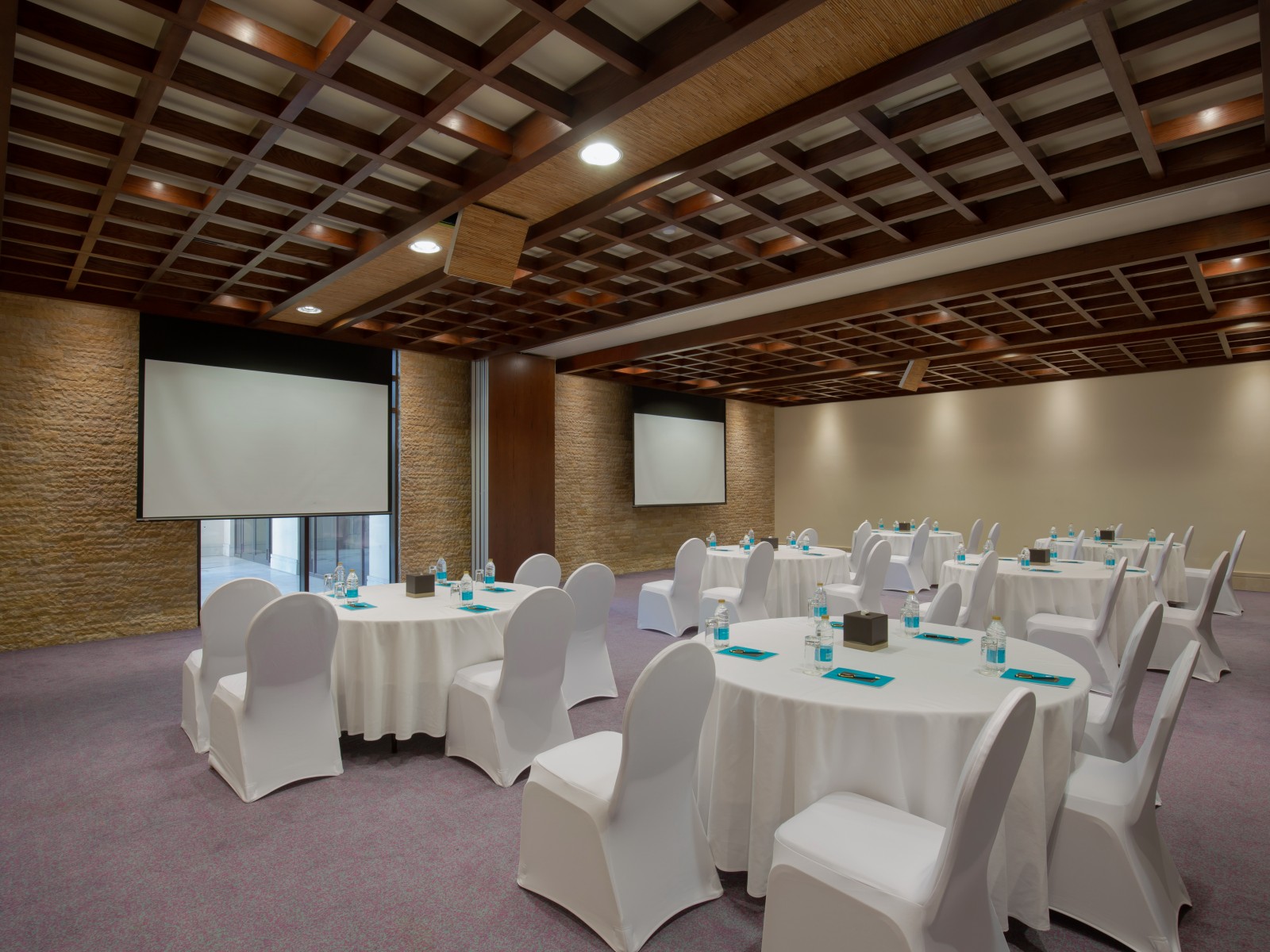 Elegant meeting room with round tables, ideal for corporate events in Dubai.