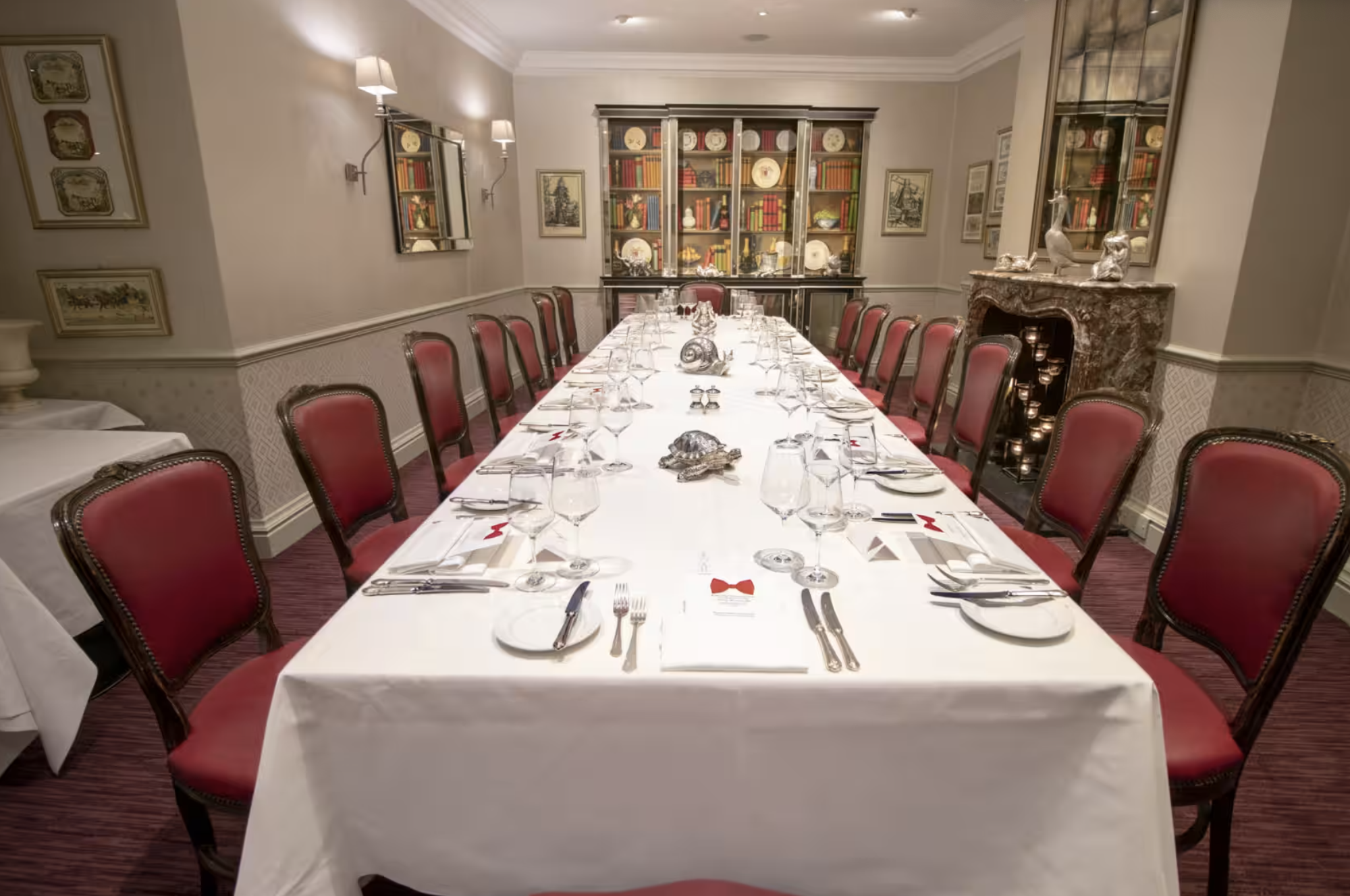 Elegant banquet table in Lanson Library, fine china, perfect for formal events.