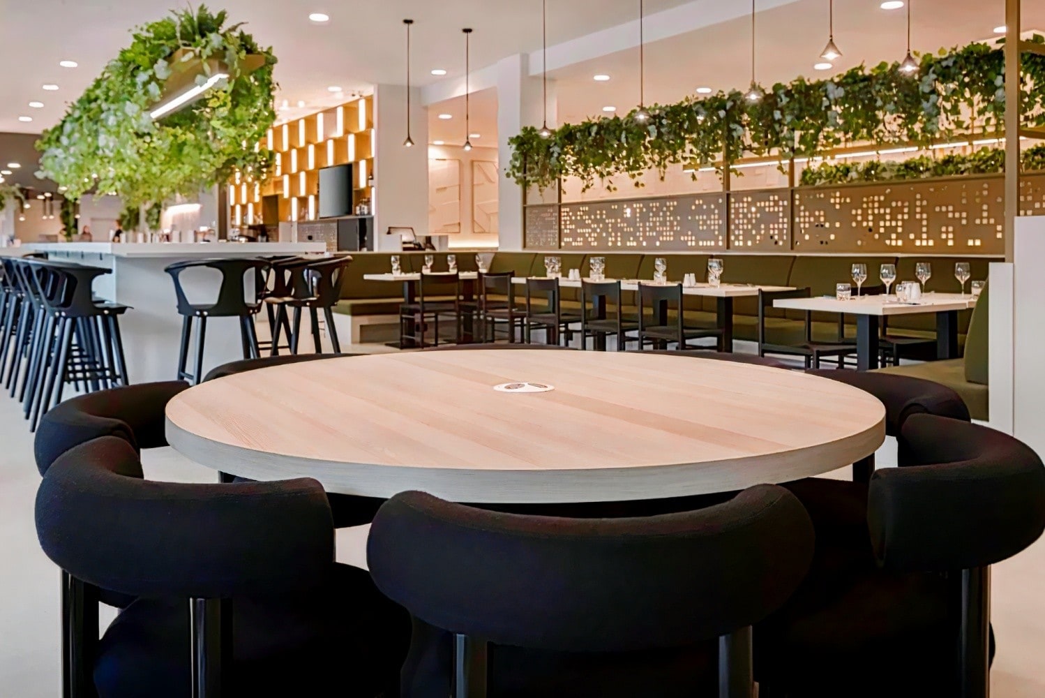 Modern event space at Leonardo Hotel Manchester with round table and sleek chairs.