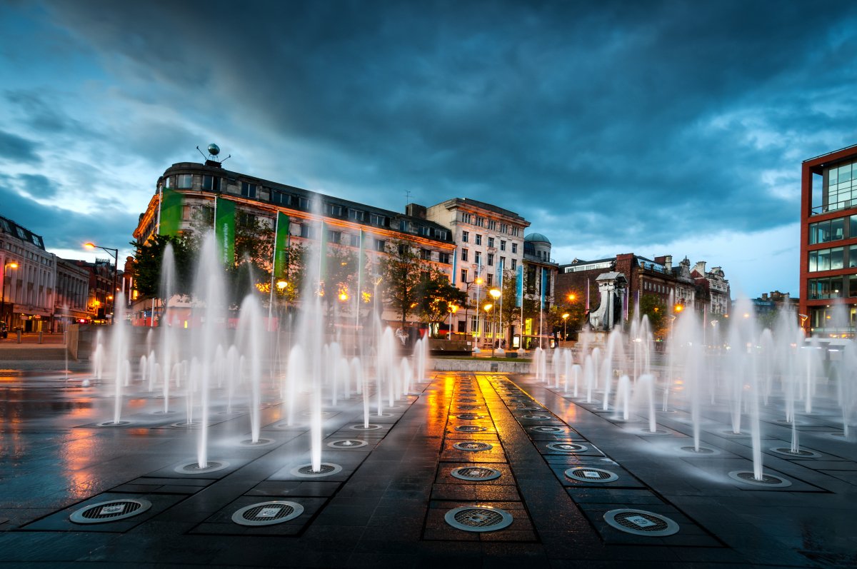 Vibrant urban plaza with fountains at Leonardo Hotel Manchester for events and gatherings.