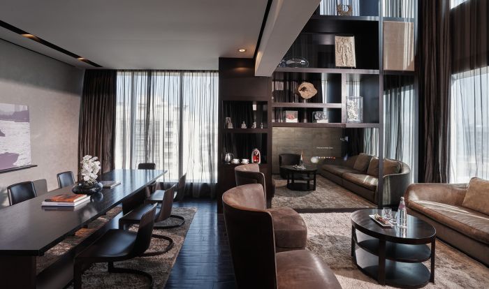 Multifunctional meeting room with modern furnishings at The Canvas Hotel for events.