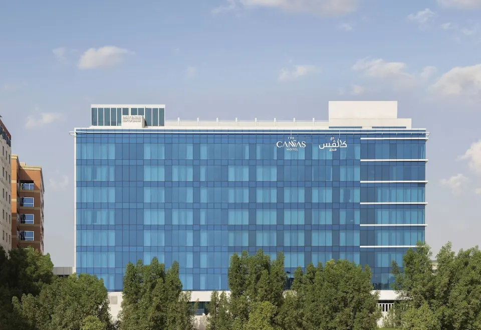 Rooftop terrace at The Canvas Hotel, modern venue for corporate events with greenery.