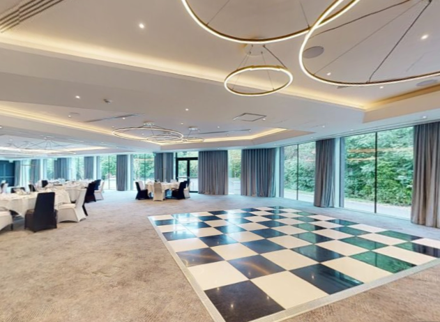 Spacious event venue with round tables, ideal for receptions and celebrations at Holiday Inn Shepperton.