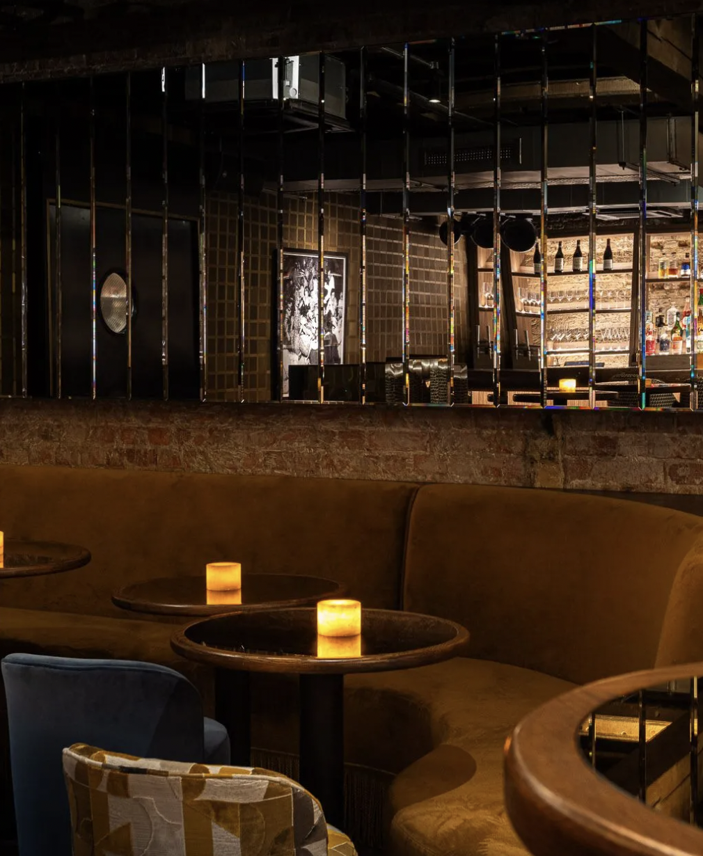 Stylish Sucre Bar with warm lighting, perfect for networking events and cocktail receptions.