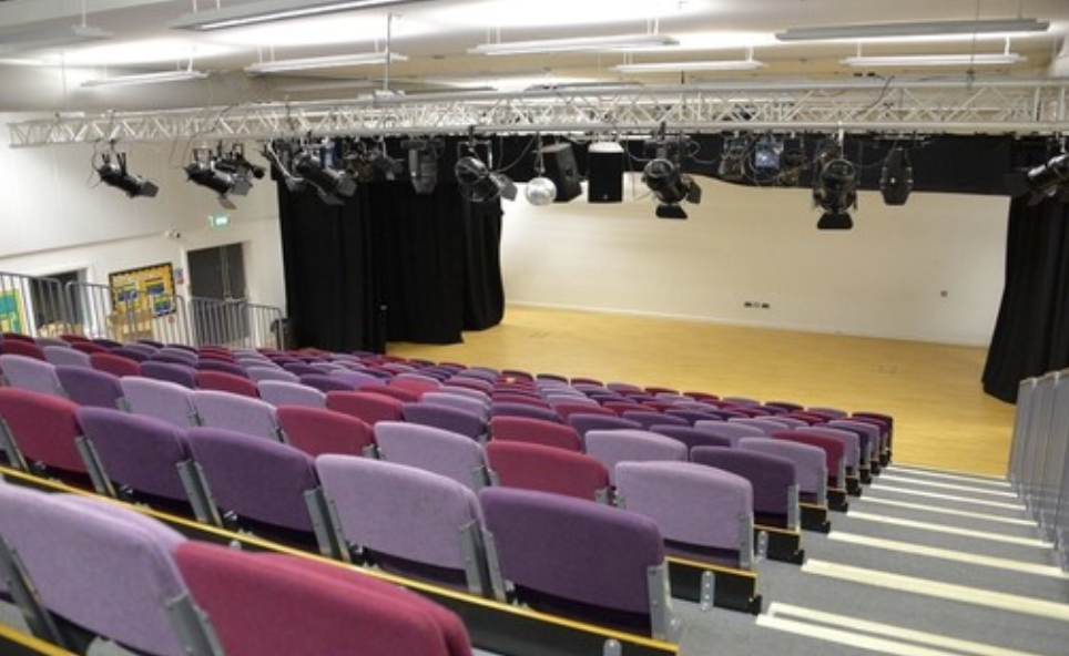 Theatre at Stockwood Park Academy with tiered seating for versatile events and performances.