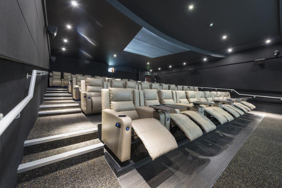 Modern ODEON LUXE Swiss Cottage theater with plush recliners for film screenings and events.