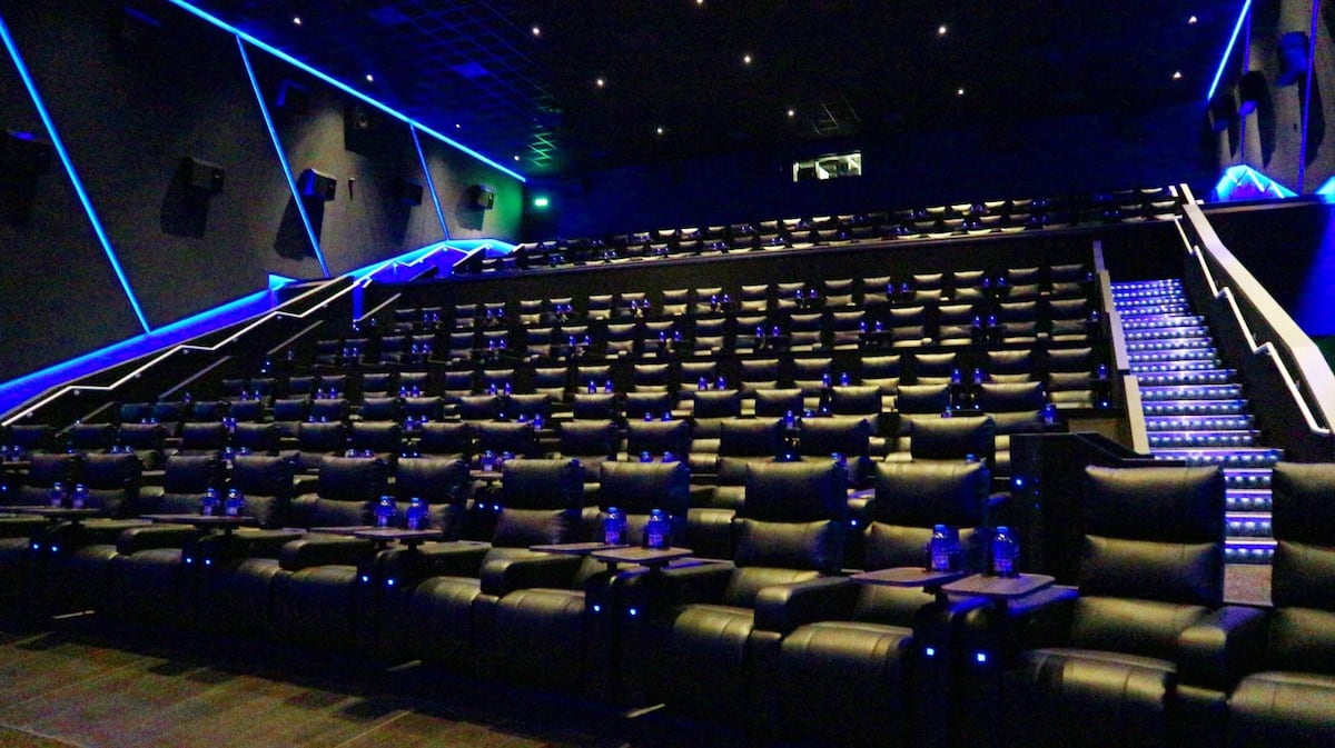 Modern cinema auditorium with plush reclining seats for private screenings and corporate events.