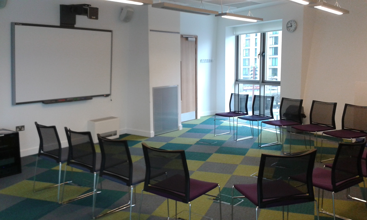 Flexible meeting room with transparent chairs for workshops at Canada Water Library.